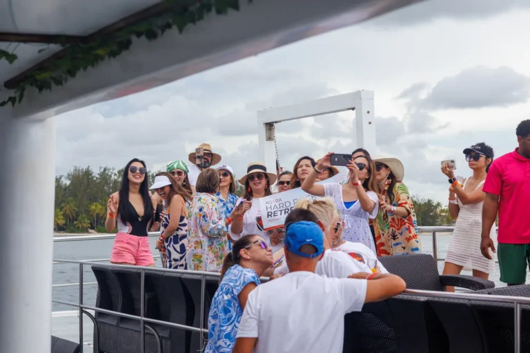Guests around the bar on the shaded deck
