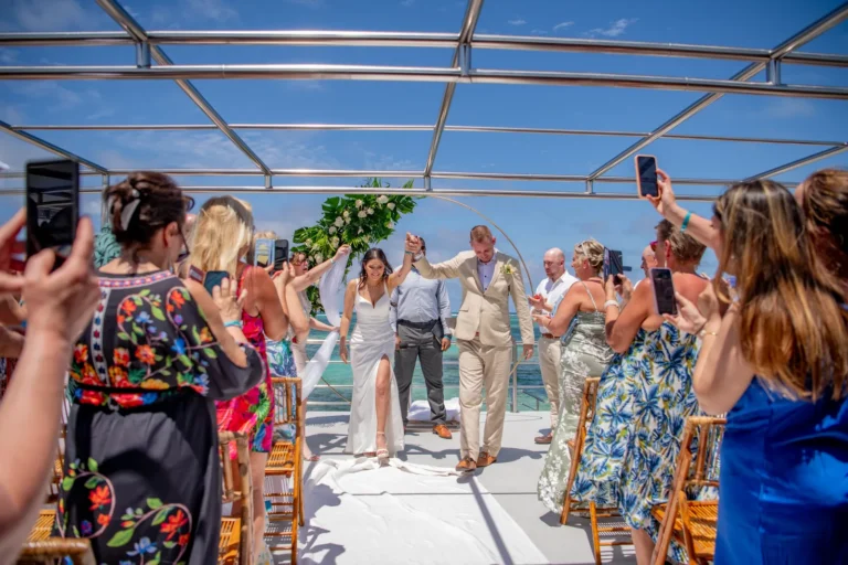 Wedding guests on the deck of a private catamaran