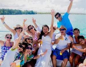 A group toasting on board during a private charter