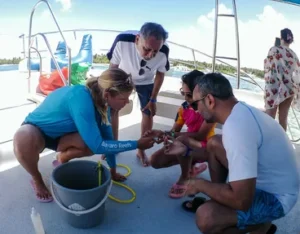 Guests being served on board after the snorkelling stop