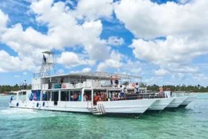 The Karaya under way off the Punta Cana coast, guests on both decks