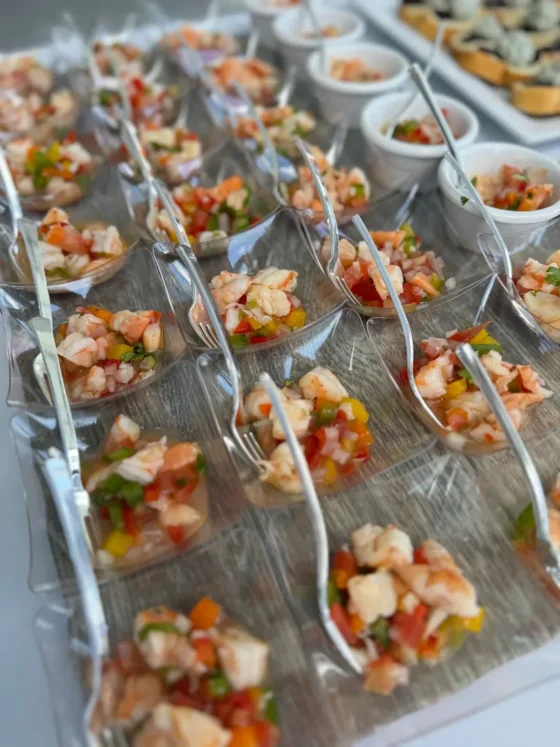 Fresh ceviche served in small clear cups with spoons