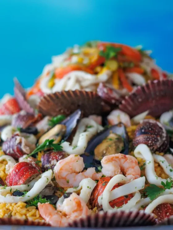 A seafood presentation with shrimp, mussels and calamari on shells