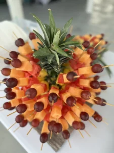 Fresh fruit skewers served on board