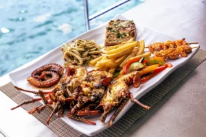 A seafood platter plated beside the water on board